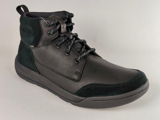 Black leather boot with lace-up design on a light gray background