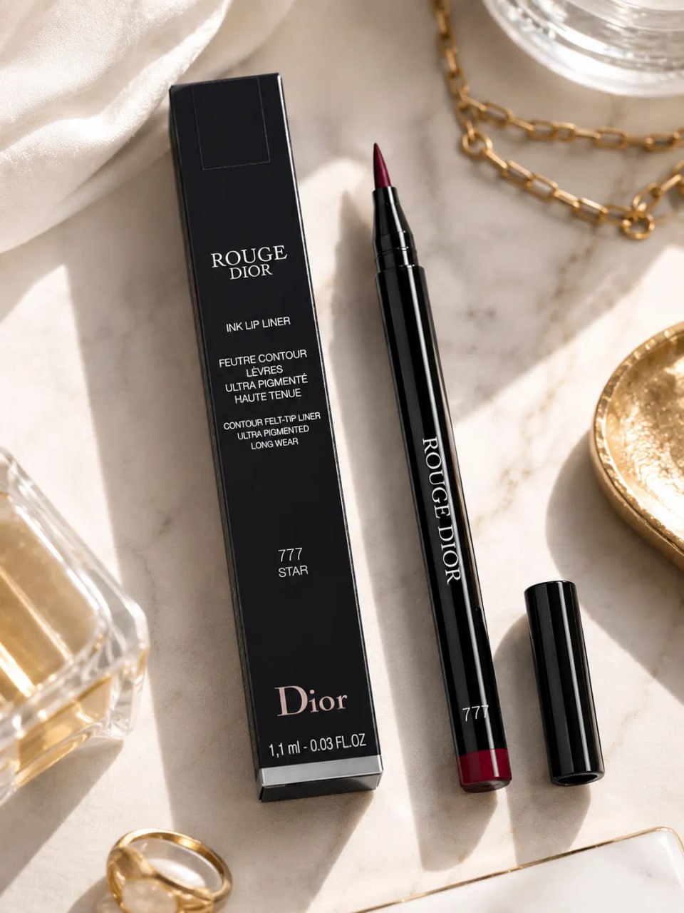 Dior lip liner with packaging on a marble surface
