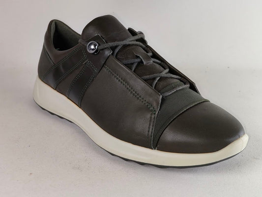 A dark brown leather sneaker with a white sole, featuring a unique snap-button lace closure on the side.
