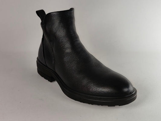 A single black leather ankle boot with a pebbled texture, elastic side gore, and a low black sole, photographed on a light gray background.