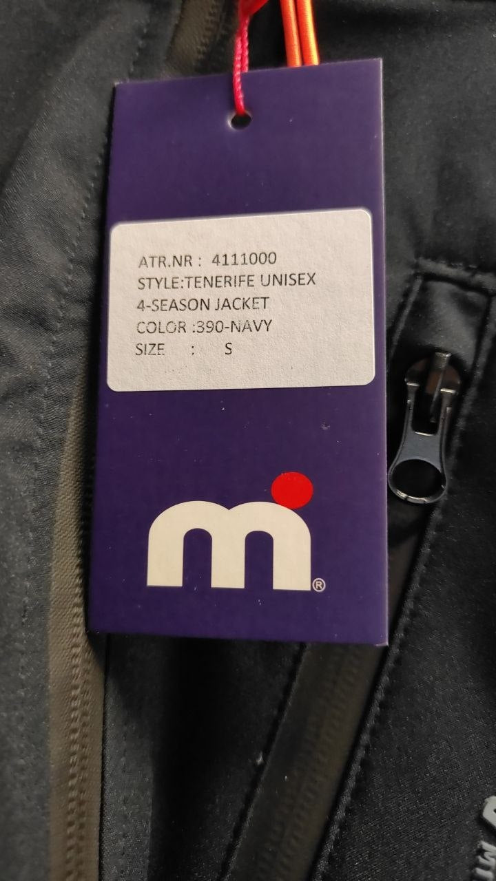 Close-up of a jacket tag with brand logo and product details.