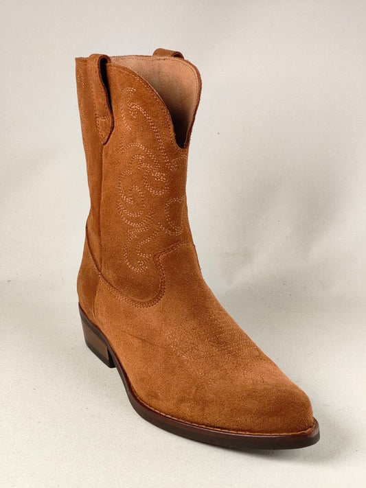 A single tan suede western boot with decorative stitching on the shaft, shown against a light gray background.