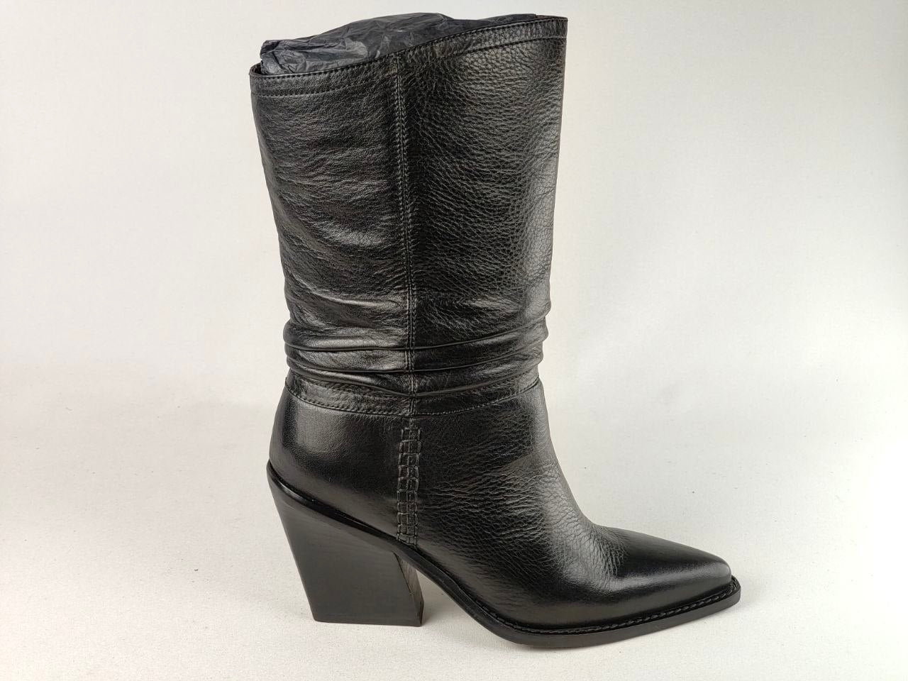 A black leather mid-calf boot with a pointed toe and a low block heel, shown from a side profile against a light gray background.
