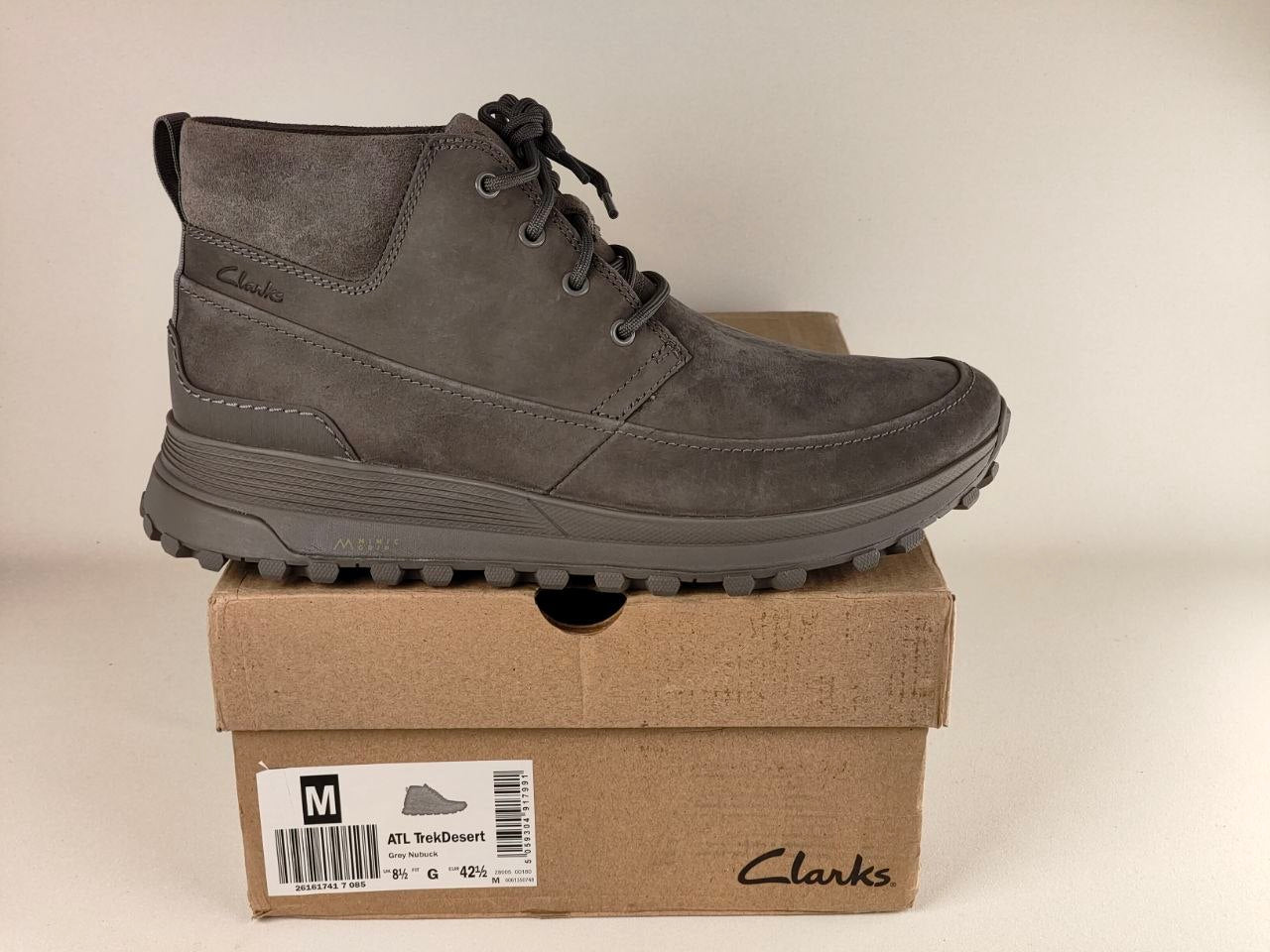 Clarks ATL Trek Desert Grey Nubuck Outdoor Boots displayed on original shoe box side profile view with a beige background