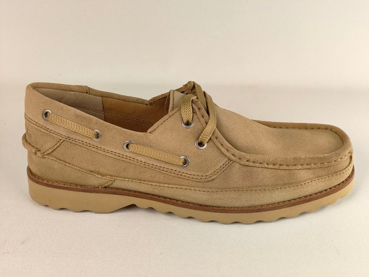 Beige boat shoe on a beige background