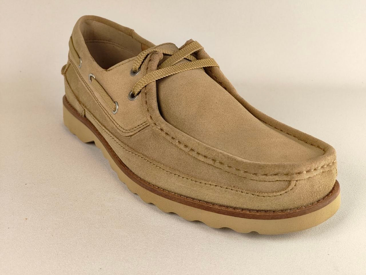 Beige loafer shoe on a beige background