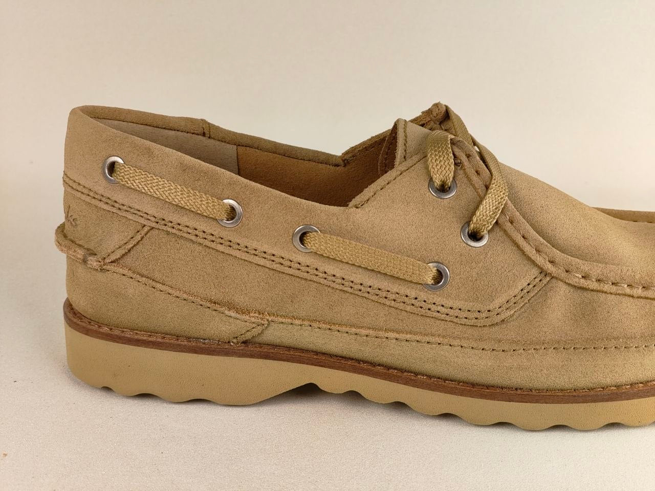 Beige boat shoe on a beige background