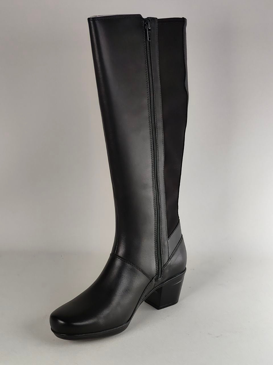 A single black knee-high leather boot with a side zipper, shown from a three-quarter angle against a neutral gray background.