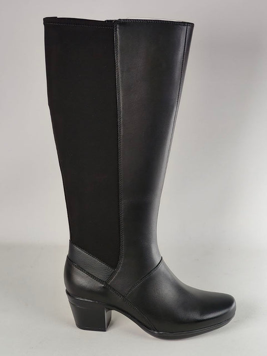 A single black knee-high boot with a smooth leather-like finish, black side panels, and a low block heel, photographed against a light gray studio background.