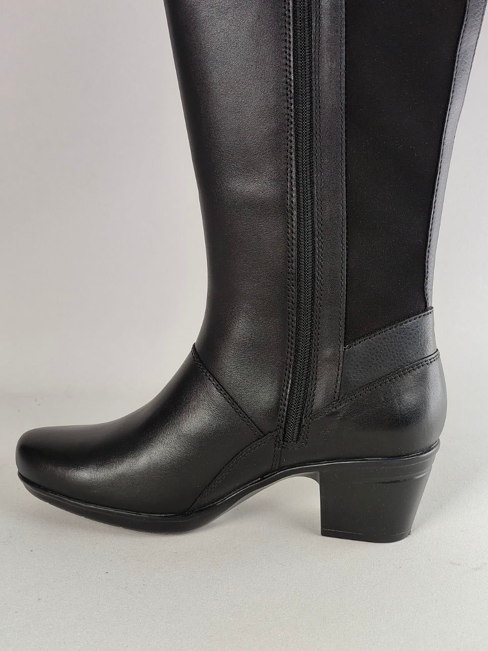 A black knee-high boot with a smooth leather shaft, a side zipper, and a low block heel, shown against a light gray background.