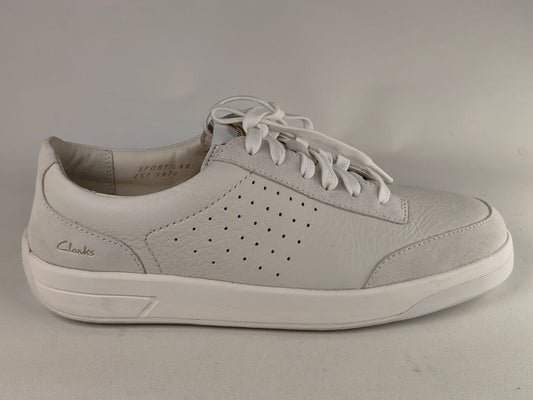 Gray sneaker with white laces on a gray background