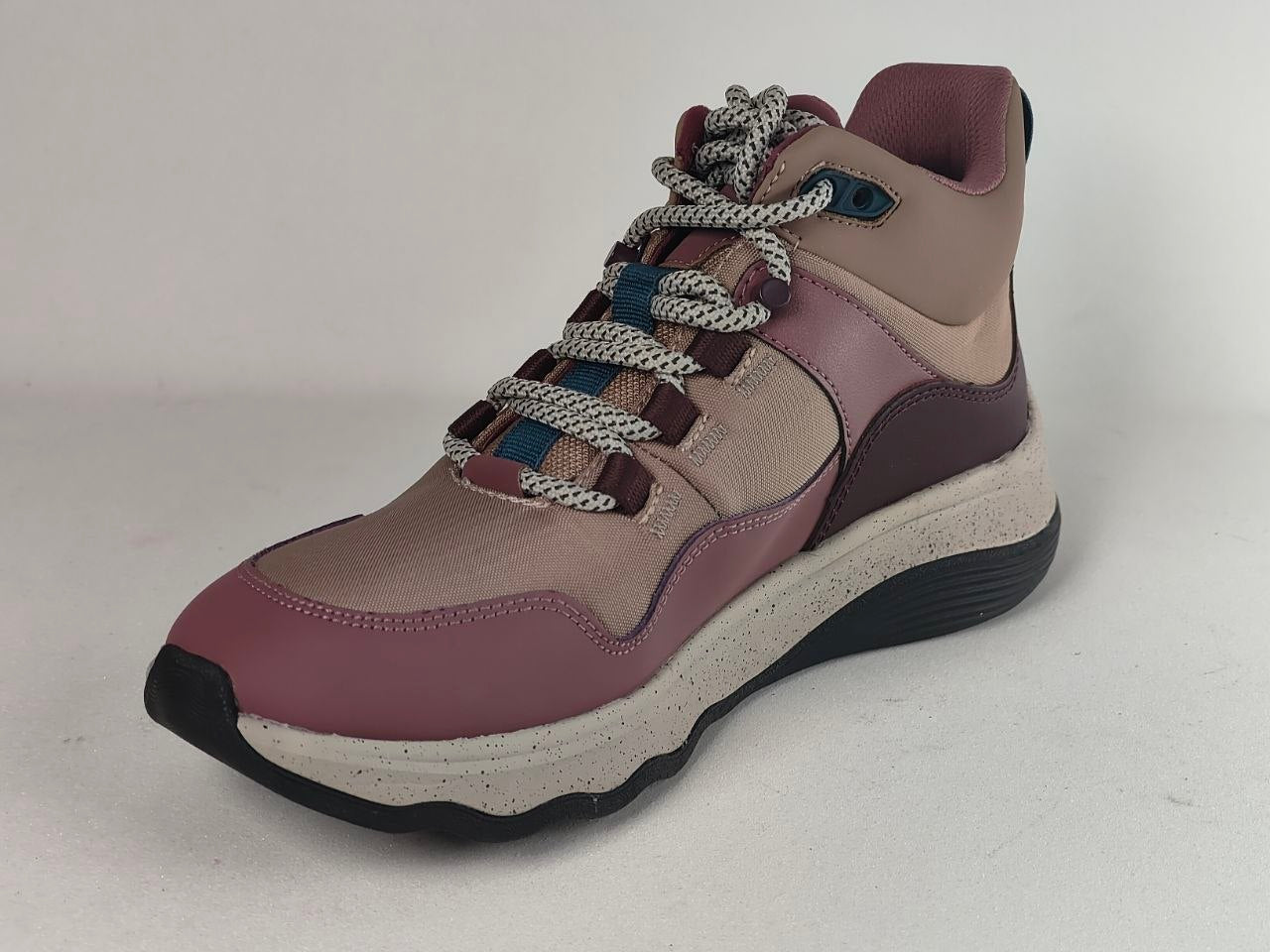 A women's mid-top sneaker boot in dusty rose and taupe, featuring chunky knotted gray laces, a thick speckled off-white midsole, and a black outsole.