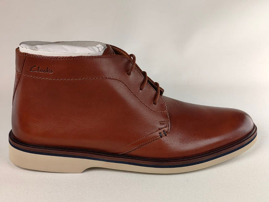 Brown leather boot with white lining on a light gray background