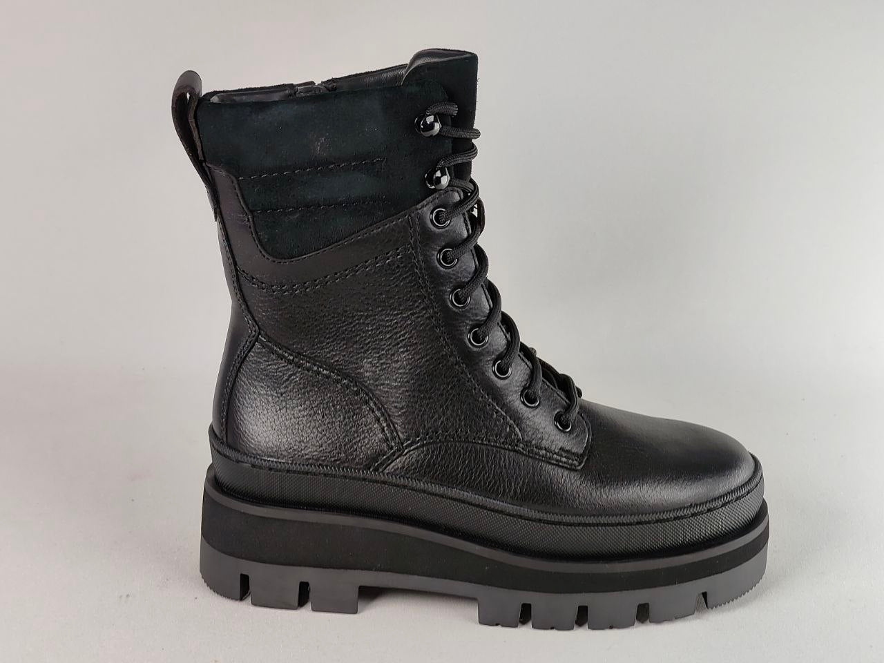 A single black leather lace-up ankle boot with a chunky black sole, shown from a side profile against a light gray background.