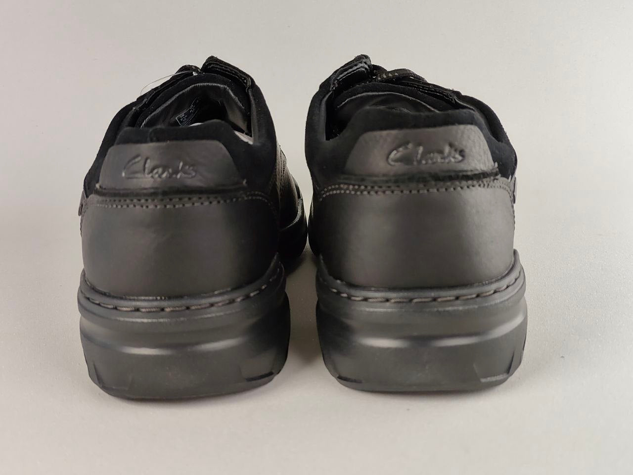 Clarks Rockie2 LoGTX Black Leather Waterproof Shoes on a light gray background
