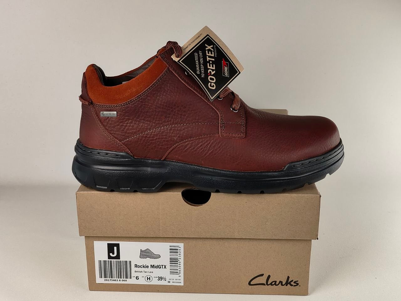 Brown leather shoe with GORE-TEX tag on a Clarks box