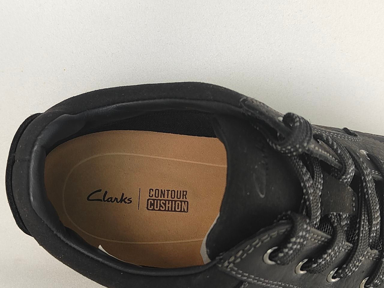 Black sneaker with 'Clarks Contour Cushion' on a white background