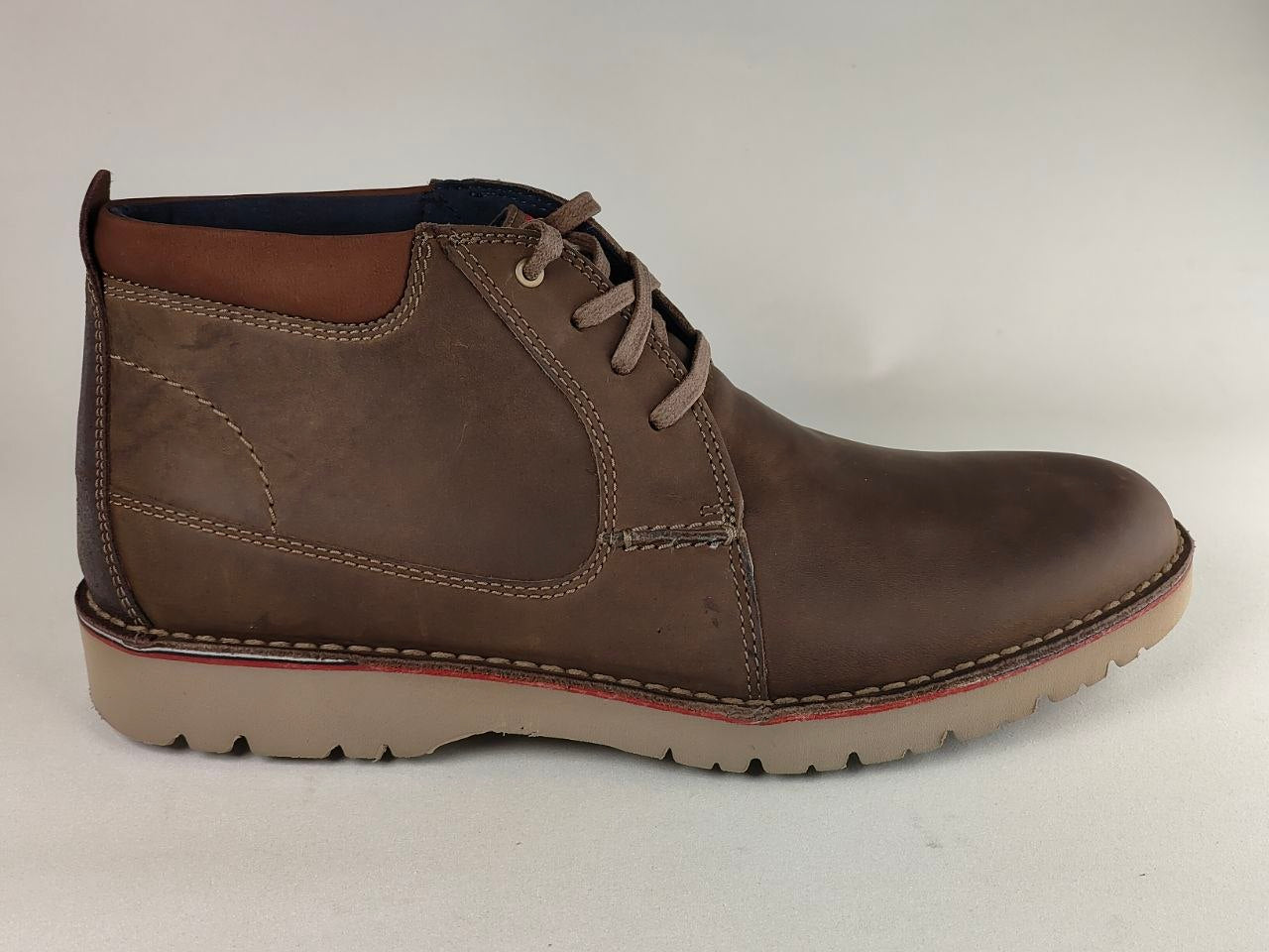 Brown leather boot on a white background