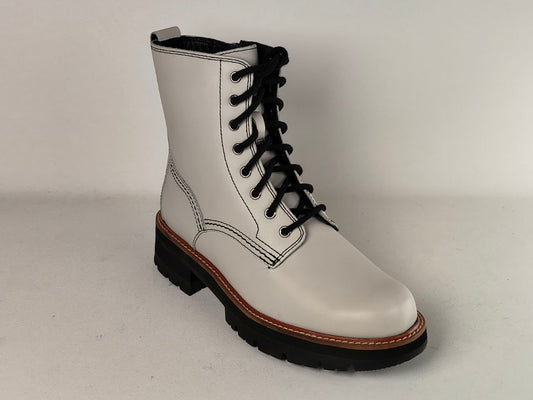 A white leather lace-up ankle boot with black laces, black sole, and a brown welt stripe, shown on a light gray background.