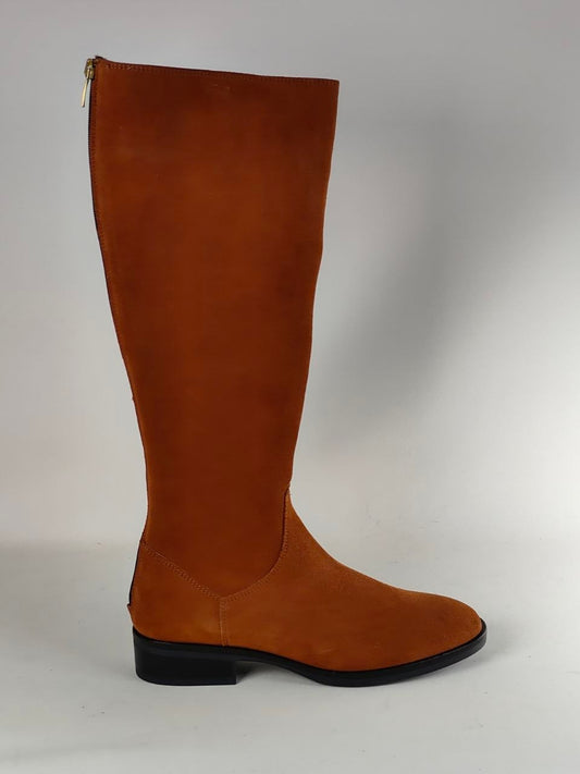 A tall brown suede knee-high boot with a low black block heel and side zipper, shown from a side profile against a neutral gray background.