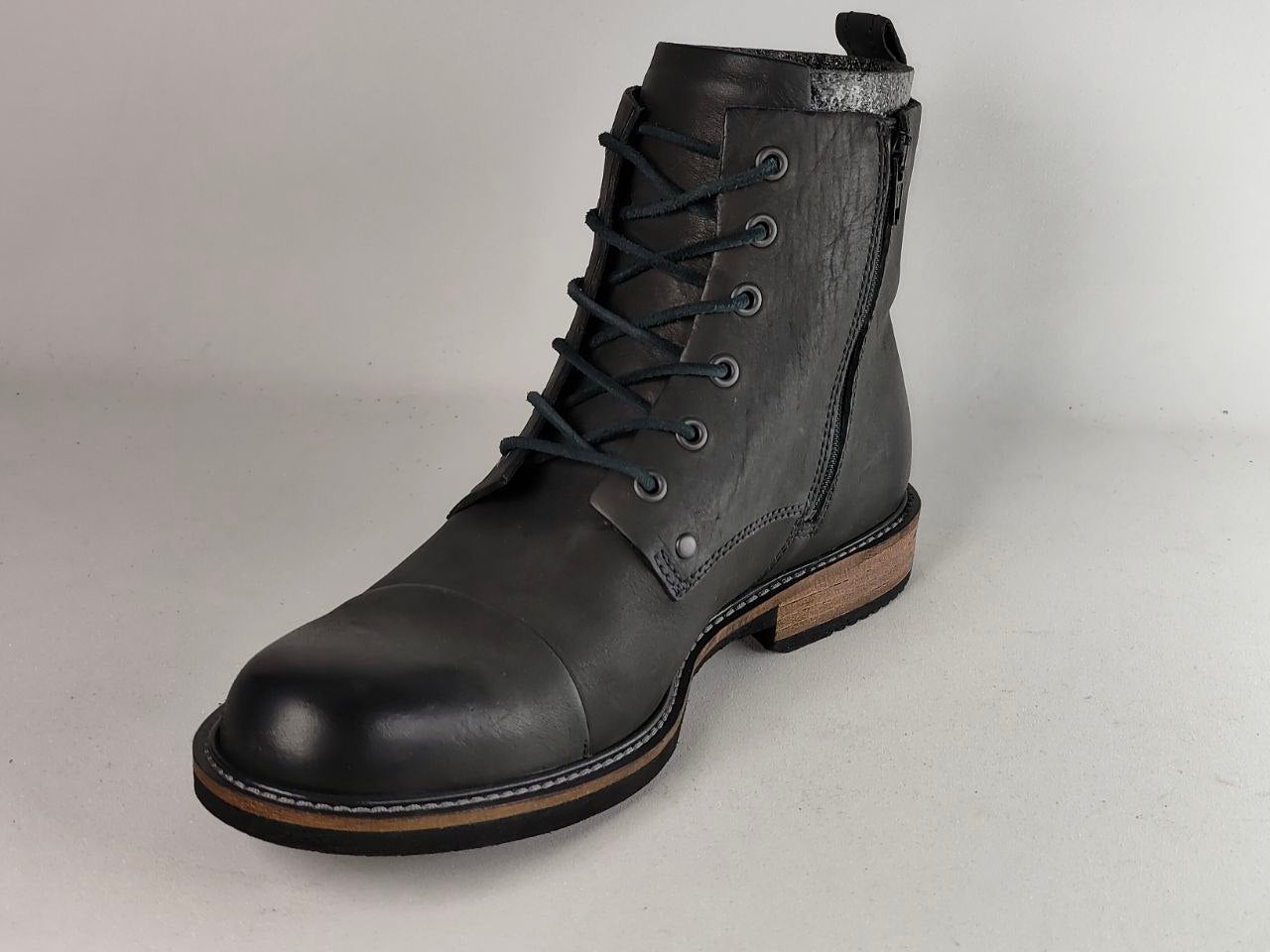 A single dark gray leather lace-up ankle boot with a side zipper, black laces, and a stacked wood-look heel, shown on a light gray background.