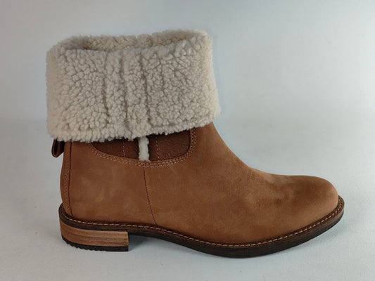 A brown suede ankle boot with a thick, fluffy cream-colored shearling-style cuff, shown from a side profile against a light gray background.