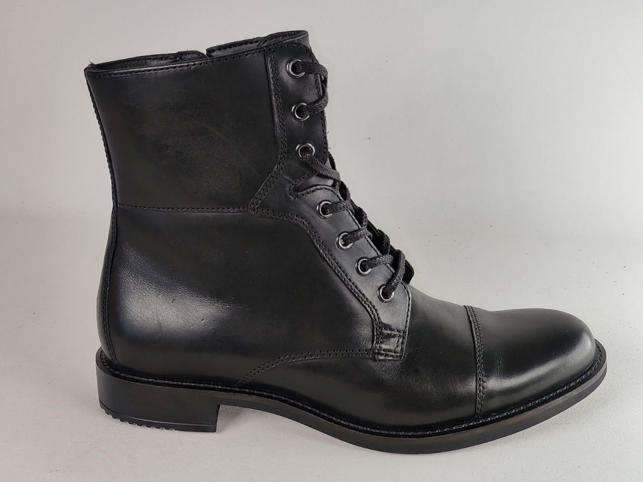 A black leather lace-up ankle boot with a cap toe and low block heel, shown from a side profile against a light gray background.