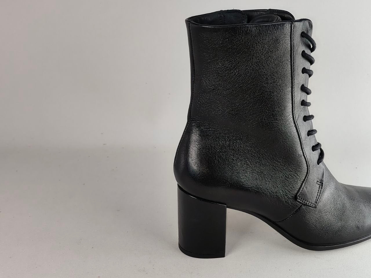 A black leather lace-up ankle boot with a block heel, shown from a side profile view against a light gray background.