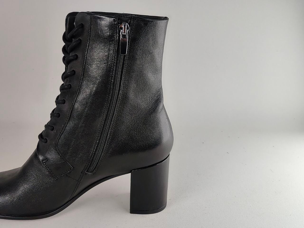 A black leather lace-up ankle boot with a side zipper and block heel, shown from a side profile view against a light gray background.