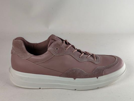A single low-top sneaker in a dusty mauve-brown colorway, featuring mixed leather and suede panels, matching laces, and a thick white platform sole, shown against a plain light gray background.