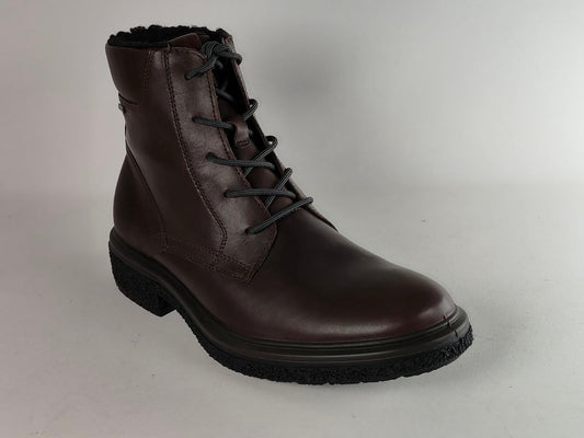 A dark brown leather lace-up ankle boot with a black sole and black laces, photographed on a light gray studio background.