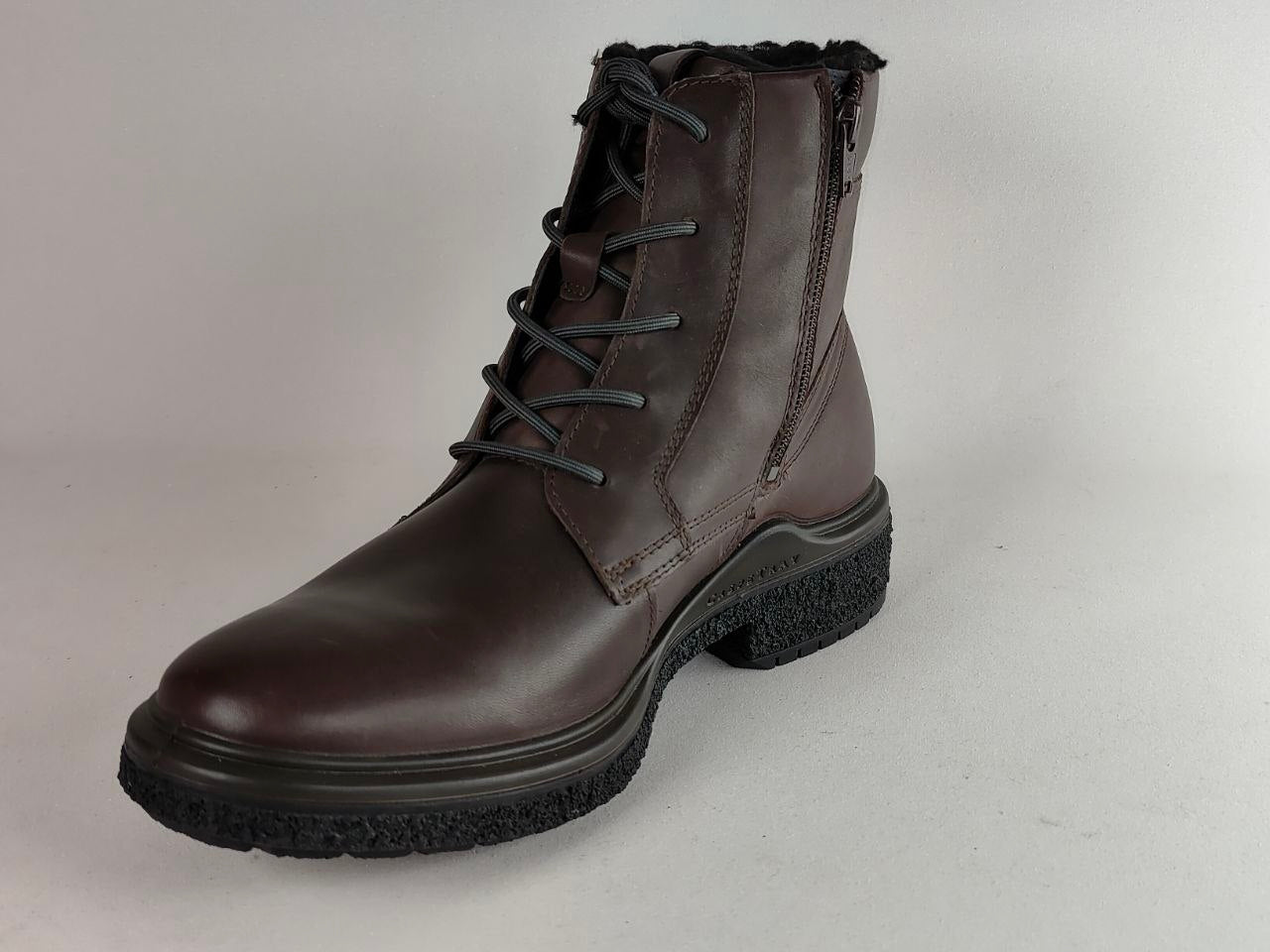 A dark brown leather lace-up ankle boot with a side zipper, black laces, and a rugged black sole, shown on a light gray background.