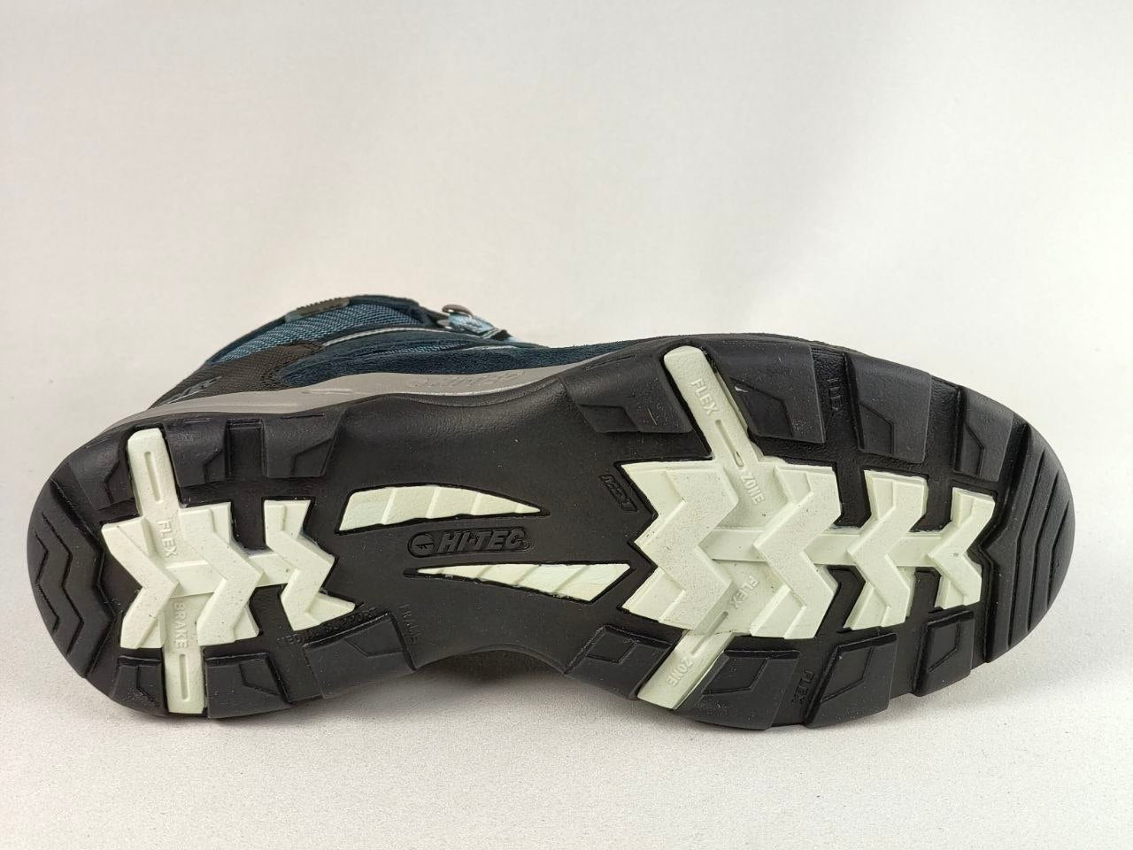The outsole of a hiking boot, showing a black tread pattern with white and gray chevron-like lugs and the brand name 'COLUMBINE' printed in the center.