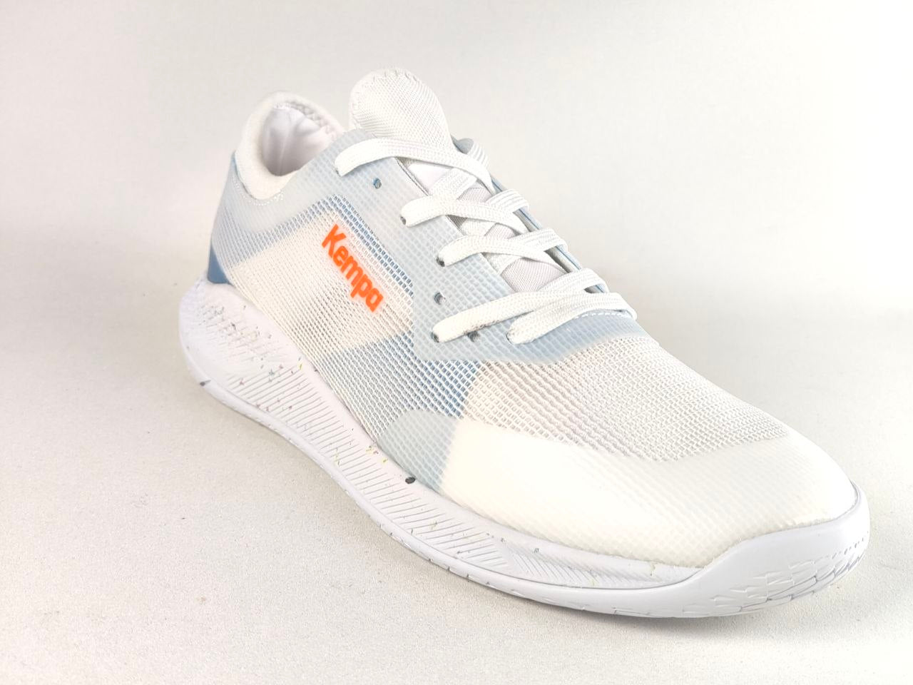 A white Kappa athletic sneaker with light blue mesh panels and an orange Kappa logo on the side, shown against a plain light background.