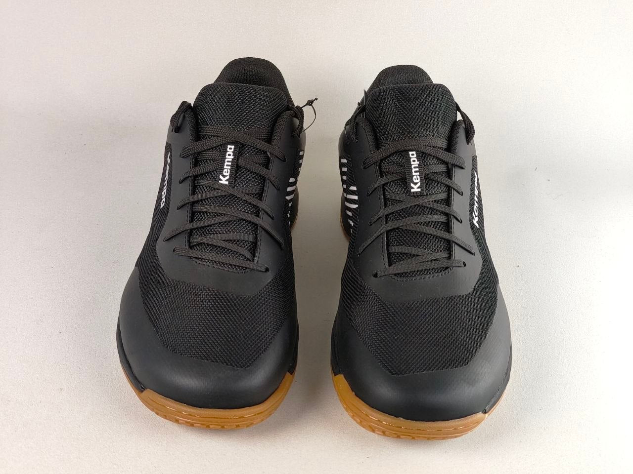 A pair of black Kempo indoor martial arts shoes with brown rubber soles, shown from the front on a light gray background.