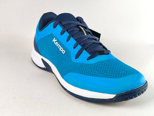 A Kempa athletic shoe in bright blue and navy blue, featuring a textured knit upper, white midsole, and navy outsole, shown on a light gray background.