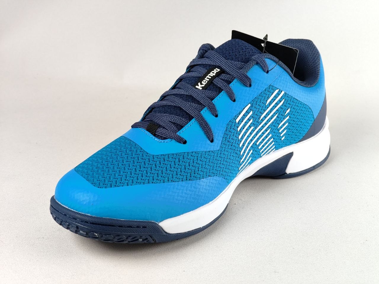 A blue and navy Kappa athletic shoe with white accents, shown from a three-quarters angle on a light gray background.