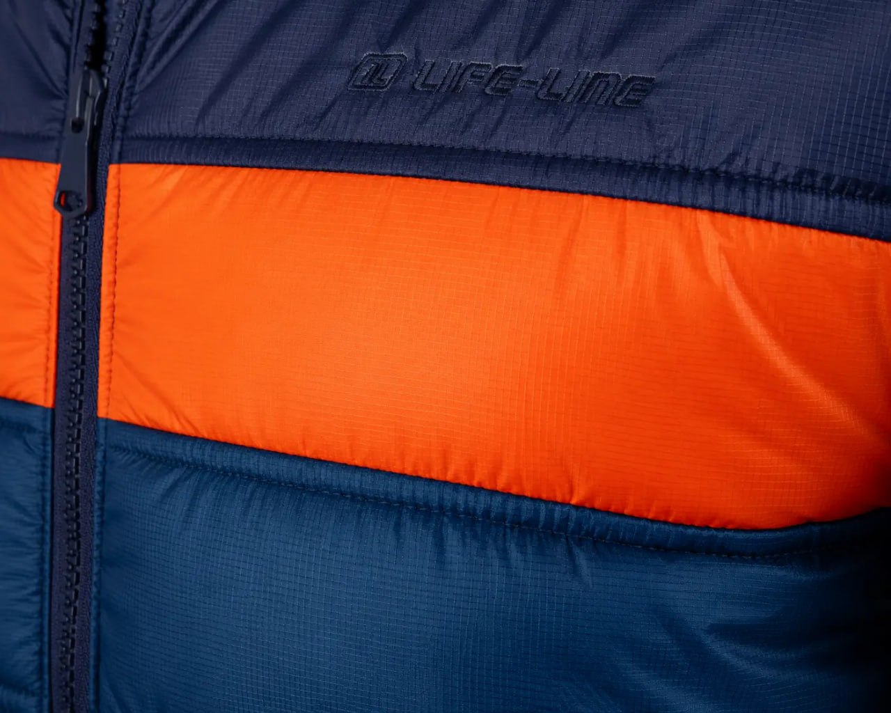 Close-up of a blue and orange jacket with 'Lifeline' branding.