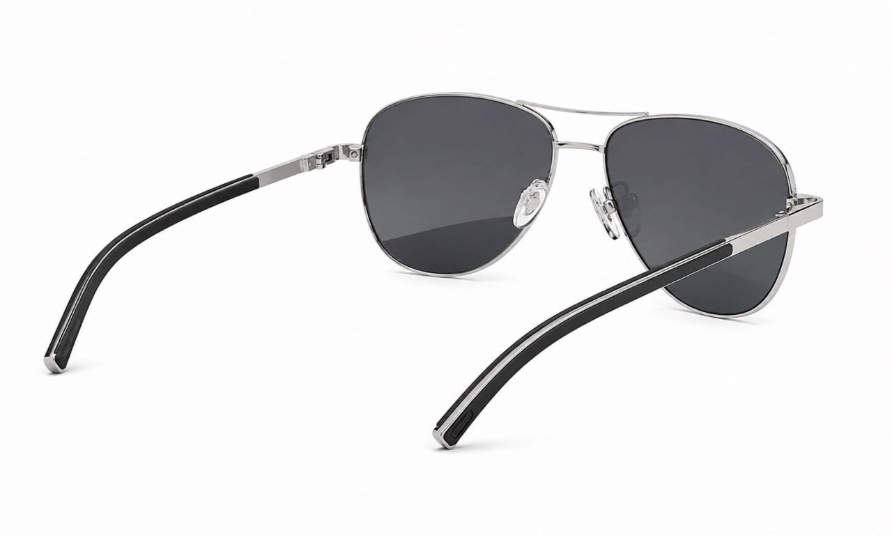 Aviator sunglasses with black lenses and silver frames on a white background