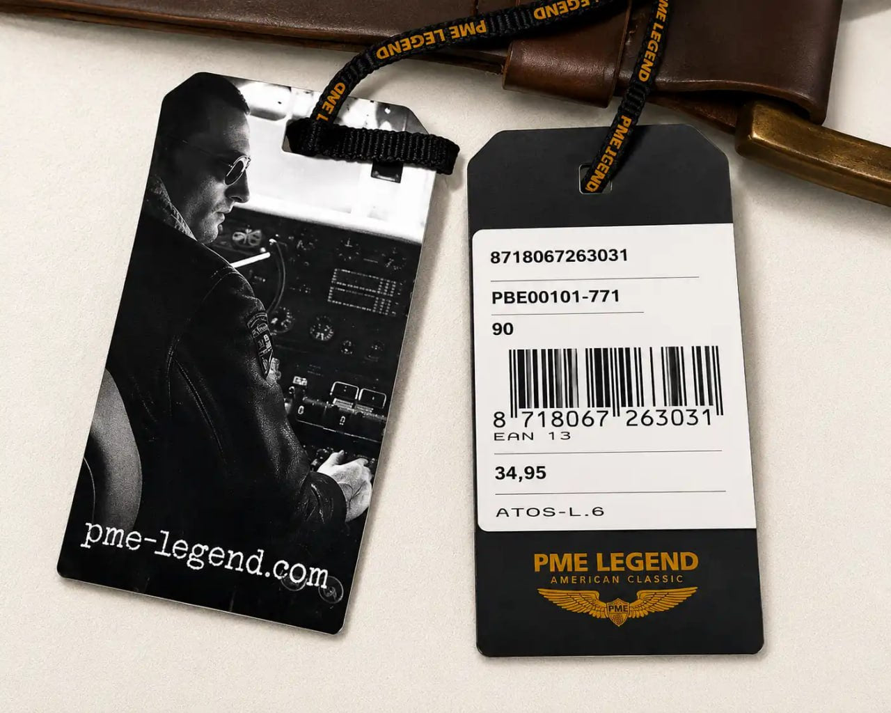 Two product tags with a barcode and text, one featuring a black and white photo of a person and the other with brand logo and text.