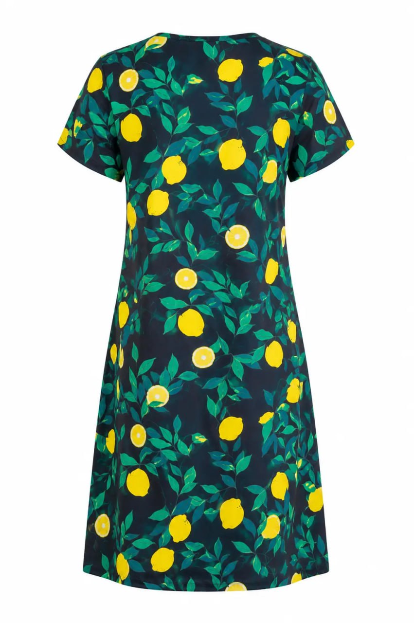 Dress with lemon and leaf pattern on a white background