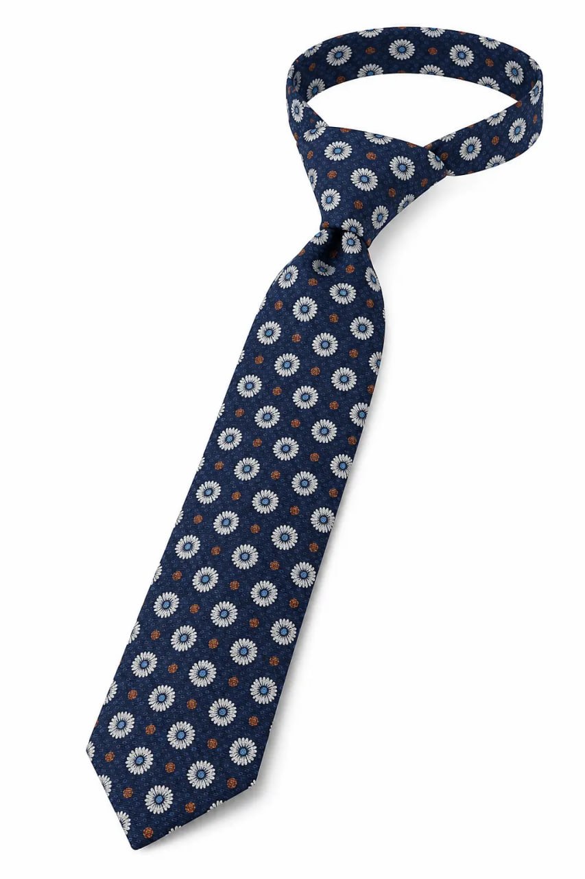 Navy blue tie with white floral pattern on a white background