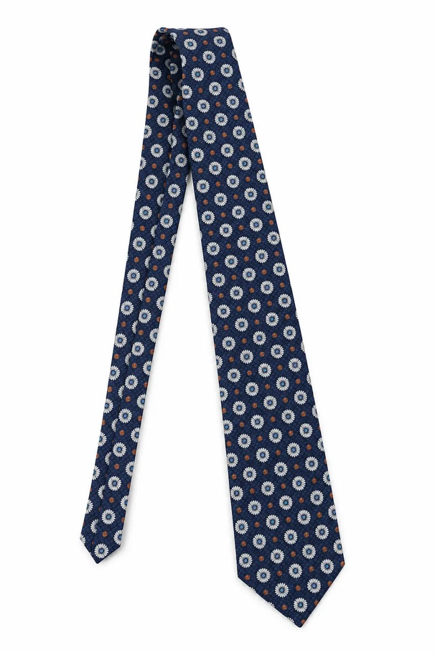 Navy blue tie with white floral pattern on a white background