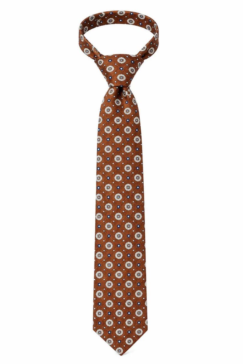 Brown patterned tie on a white background